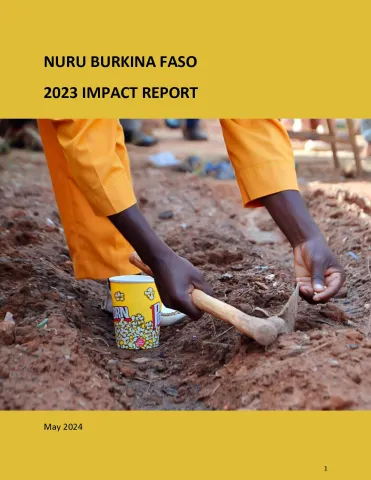 This is the report cover for Nuru Burkina Faso 2023 Impact Report.  It shows a person planting seeds.