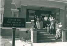 This is a picture of Ray Marshall Center staff on the porch of the Old Maxey House in April 1992.