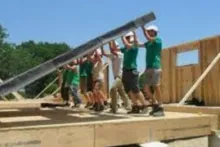 This image shows people constructing a house.