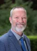 Daniel G. Schroeder, PhD This image shows Daniel Schroeder, a Research Scientist at the Ray Marshall Center at the University of Texas at Austin. He has a light complexion, gray hair and beard, and is smiling.