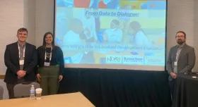 This is a picture of a presentation at the American Evaluation Association's 2023 conference. 