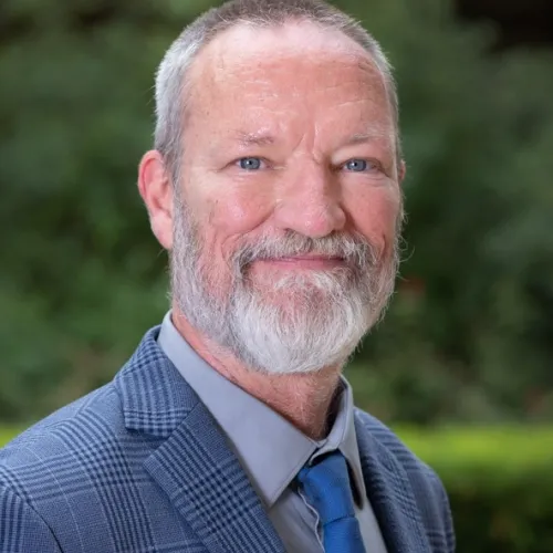 Daniel G. Schroeder, PhD This image shows Daniel Schroeder, a Research Scientist at the Ray Marshall Center at the University of Texas at Austin. He has a light complexion, gray hair and beard, and is smiling.