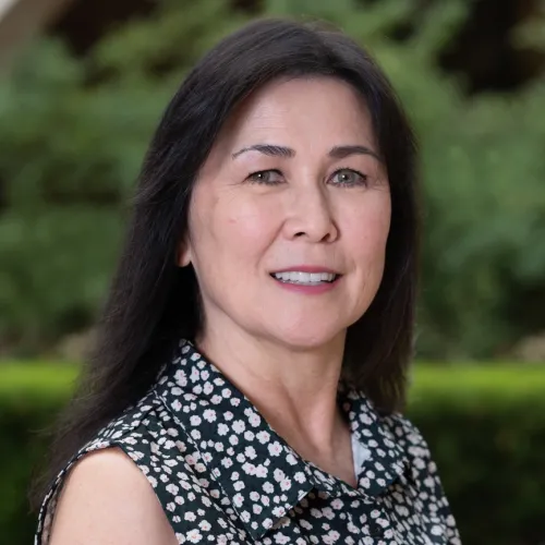 This is Patty Rodriguez, the Data Manager at the Ray Marshall Center at the University of Texas at Austin.  She has a light complexion, long dark hair, and is smiling.