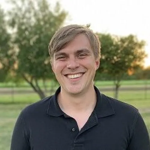 This is an image of Thomas Boswell, a Social Science Research Associate at the Ray Marshall Center at the University of Texas at Austin.  He has a light complexion, dark blonde hair, and is smiling.